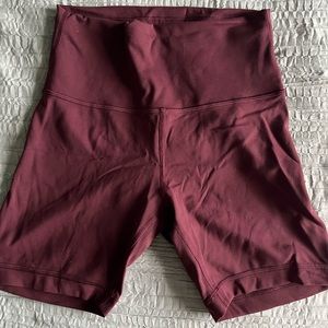 Wunder train high rise shorts 6”. Color is cassis